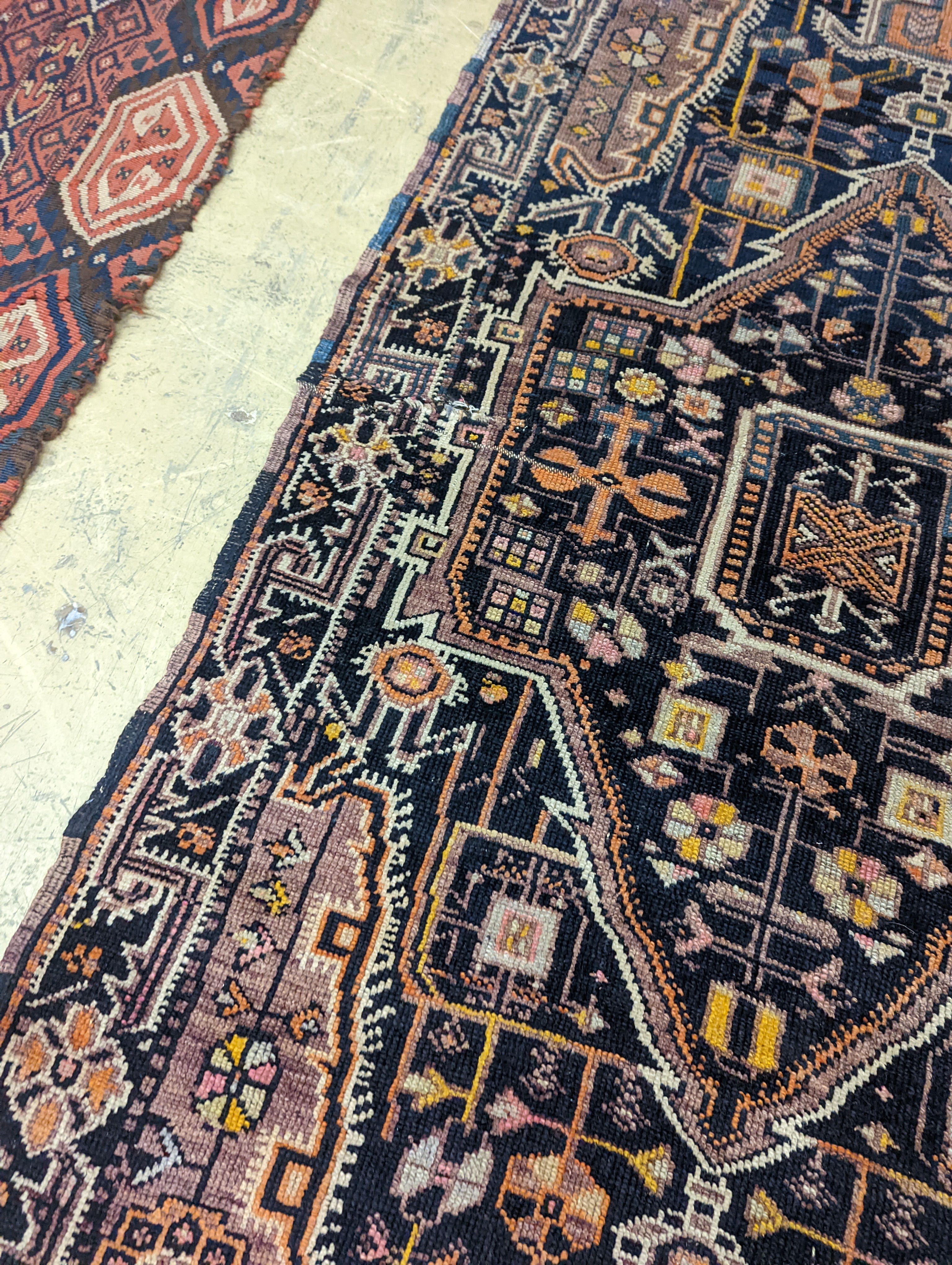 A Caucasian design blue ground rug, 224 x 111cm